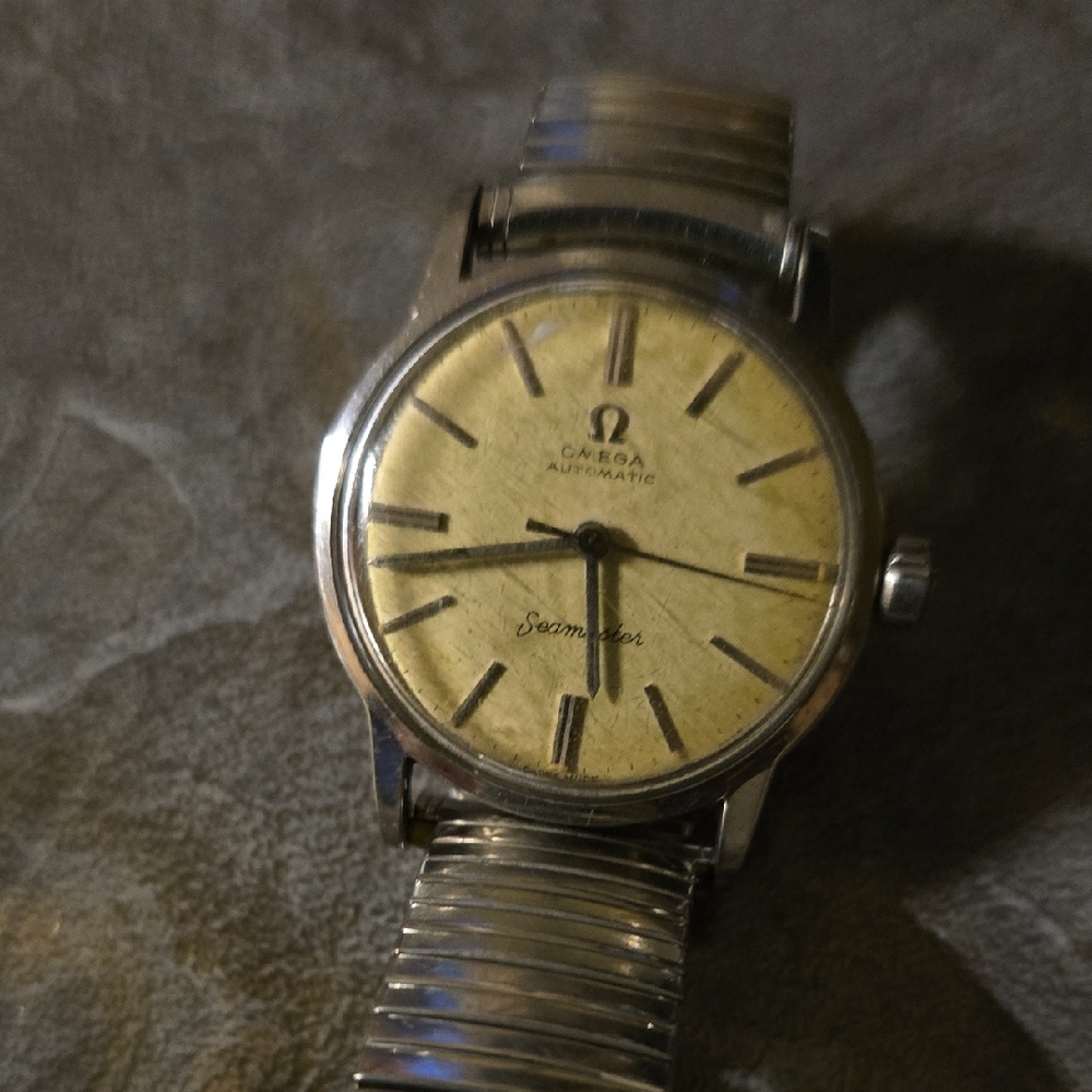 Omega Seamaster with Silver Bracelet and Gold Face